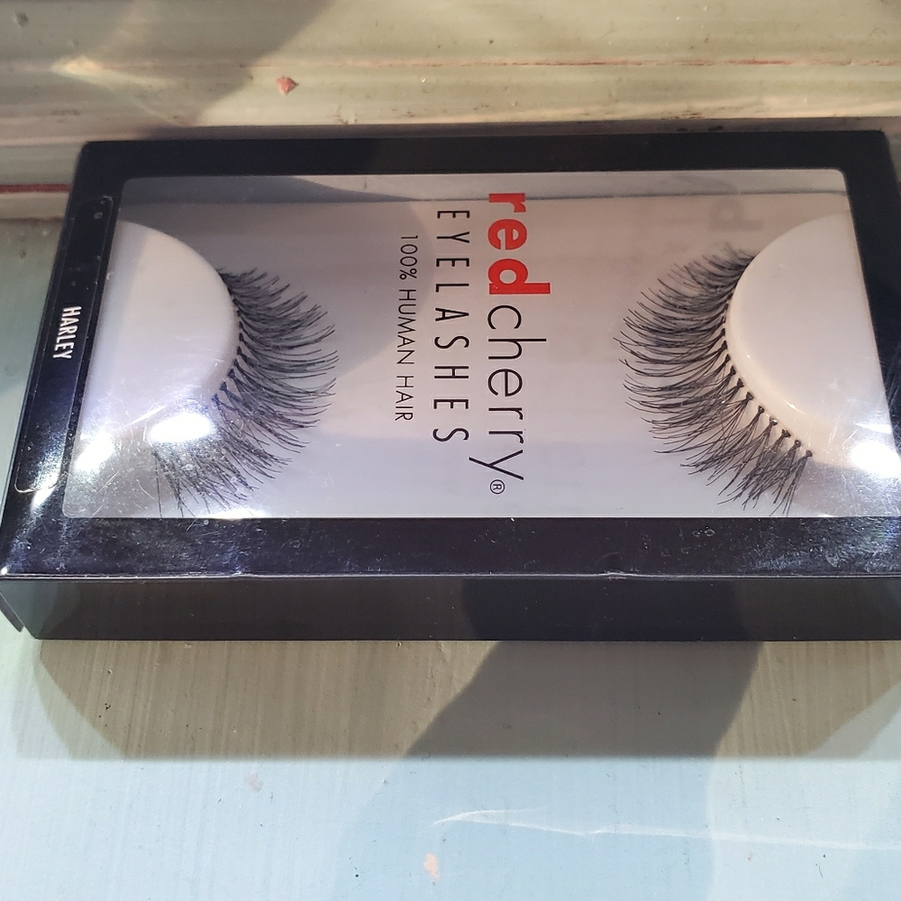 Red cherry false eyelashes.
